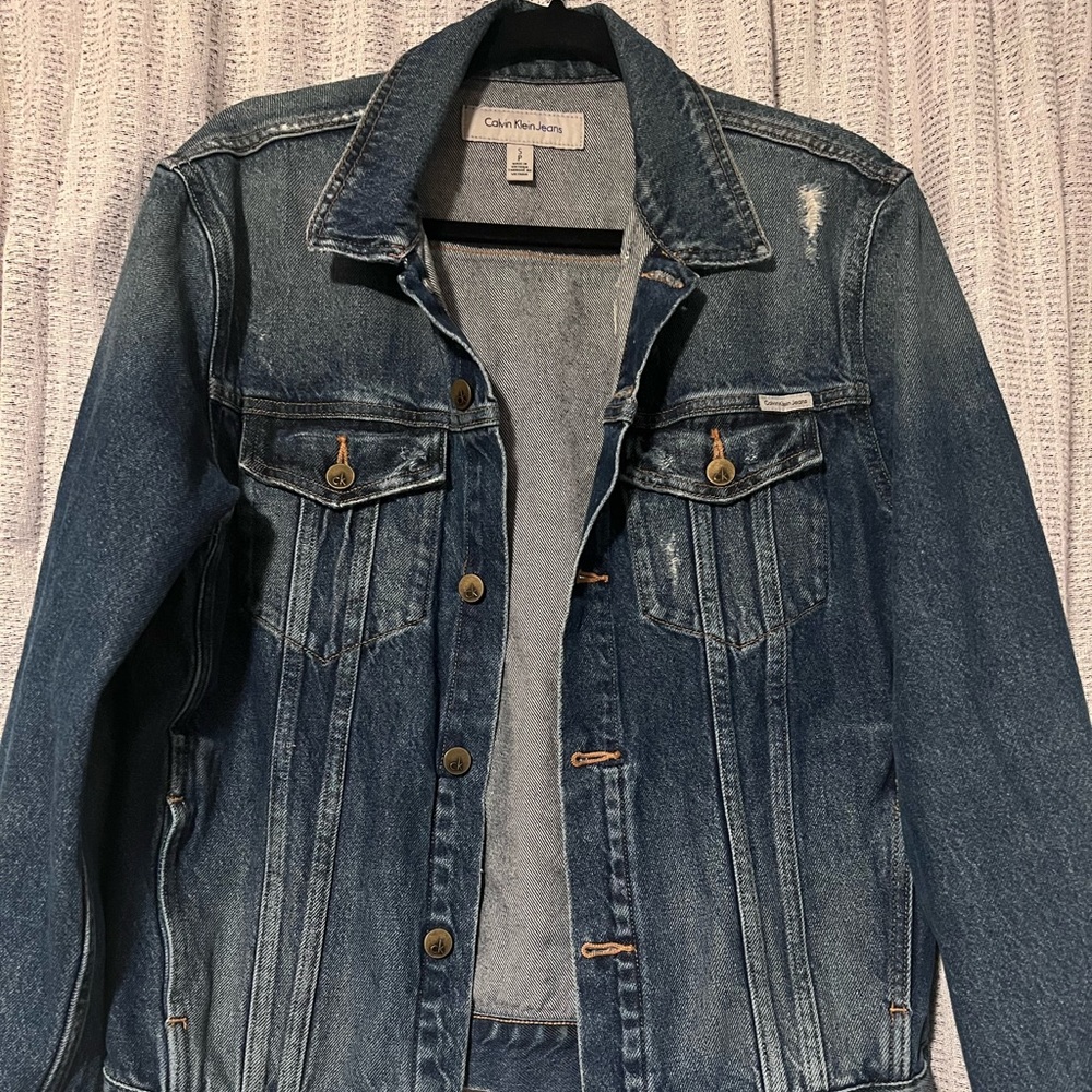 Women Jean jacket. Dark wash with distress style